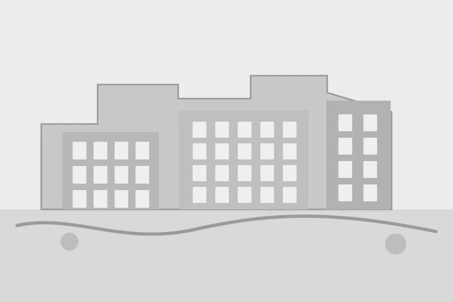 Simple grey architectural massing model with minimal facade detail